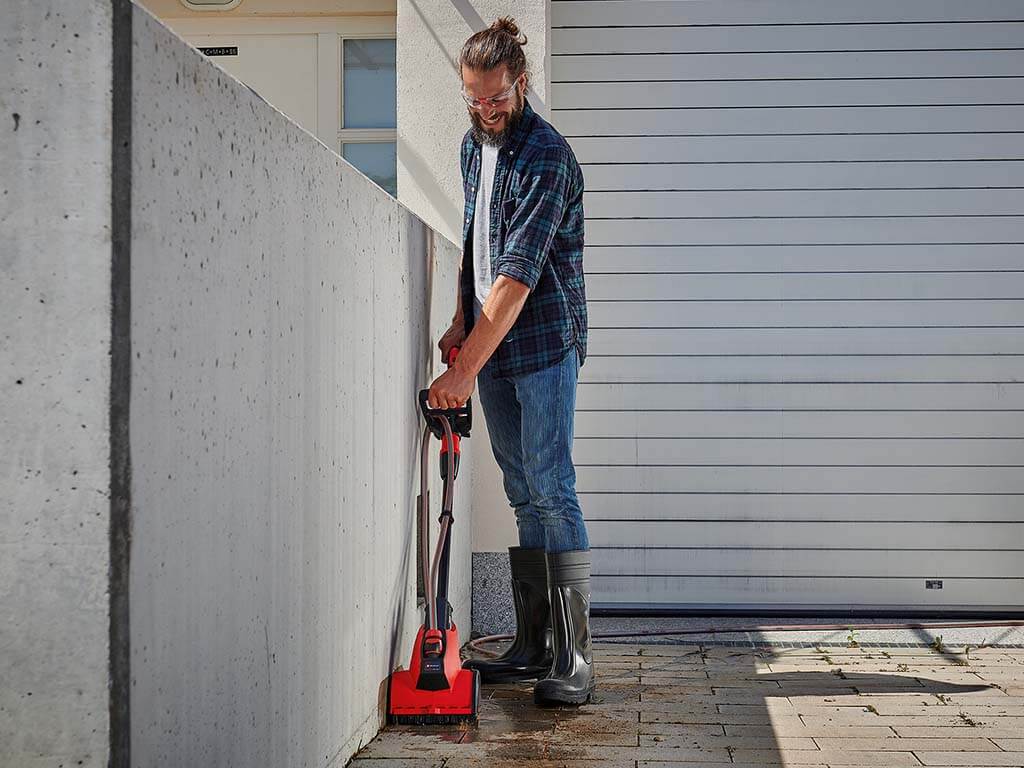 paving is cleaned with a surface brush