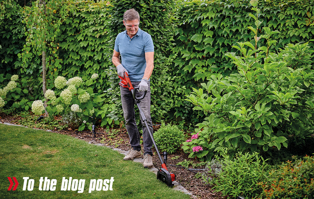 A man trimming the lawn.