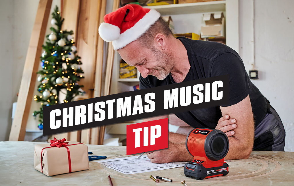 Man is listening to music with the Einhell cordless speaker