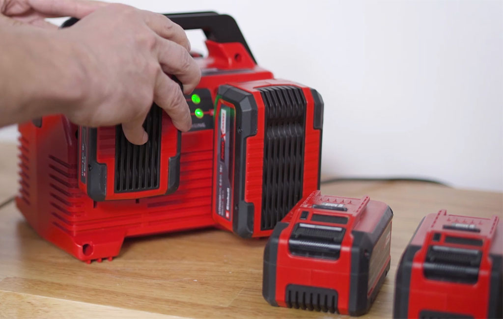 a Einhell 2x2 Power X-Quattrocharger 4A with batteries