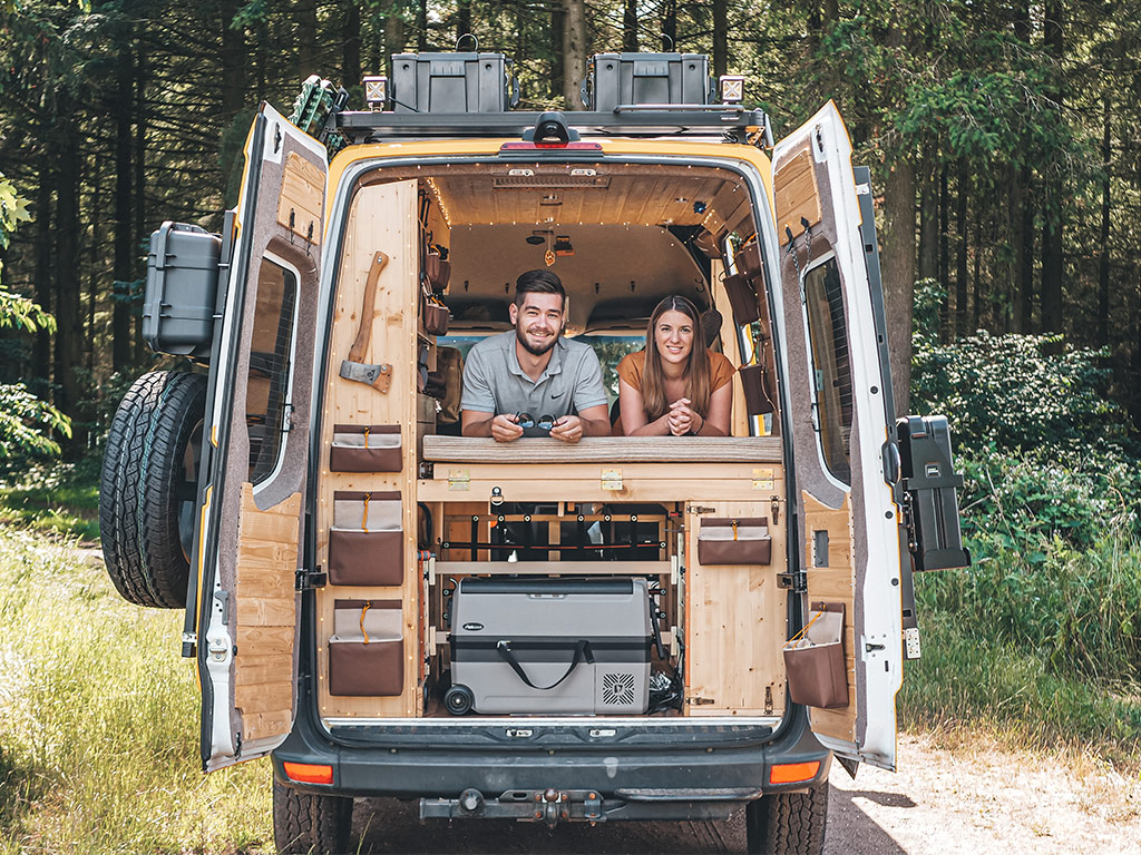 2 people on camper bed